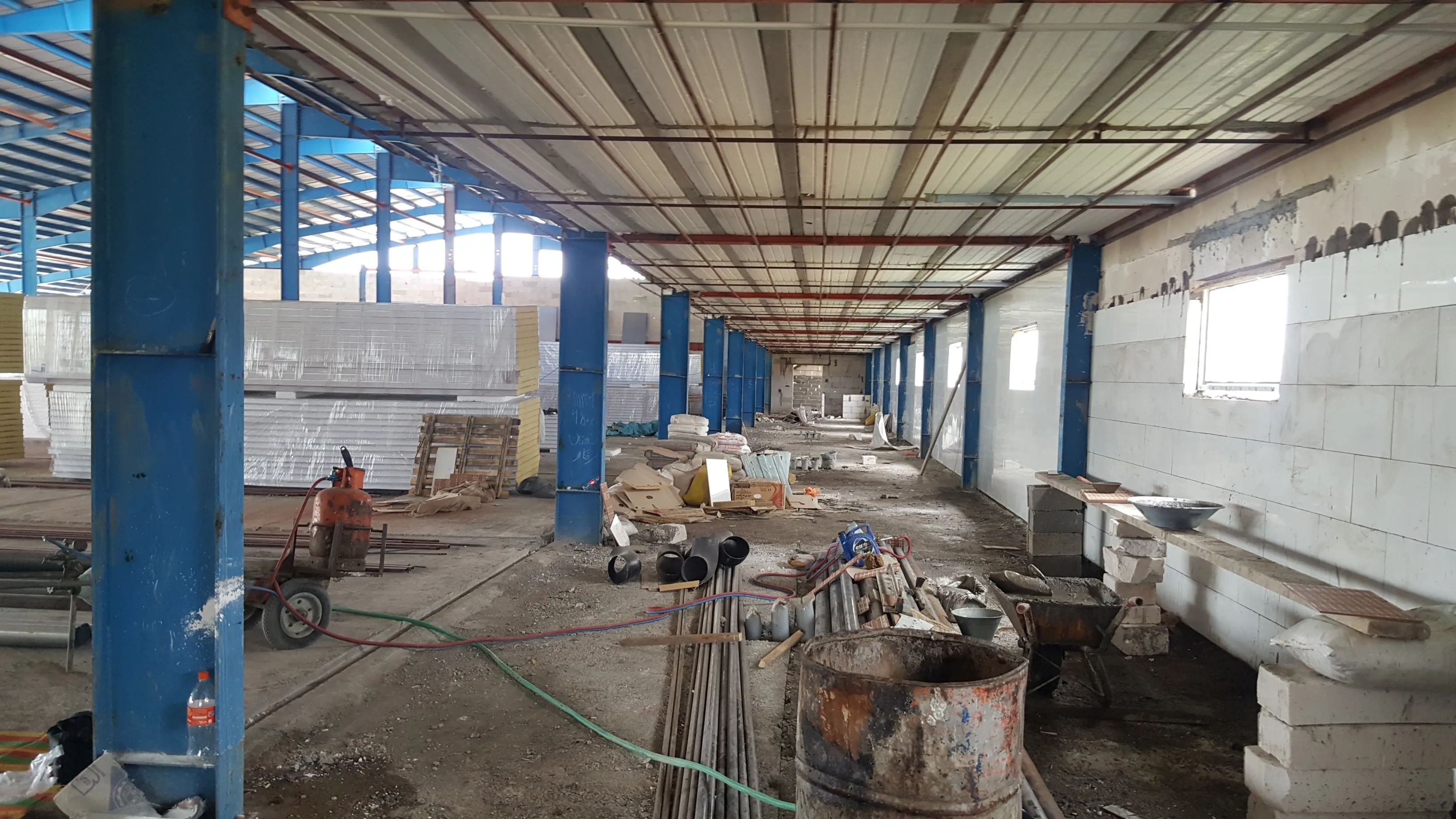TBN International growing racks — wide view across the hall